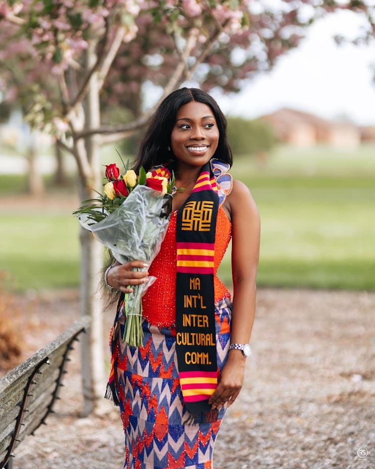 Julia Asamoa holding flowers at her graduation